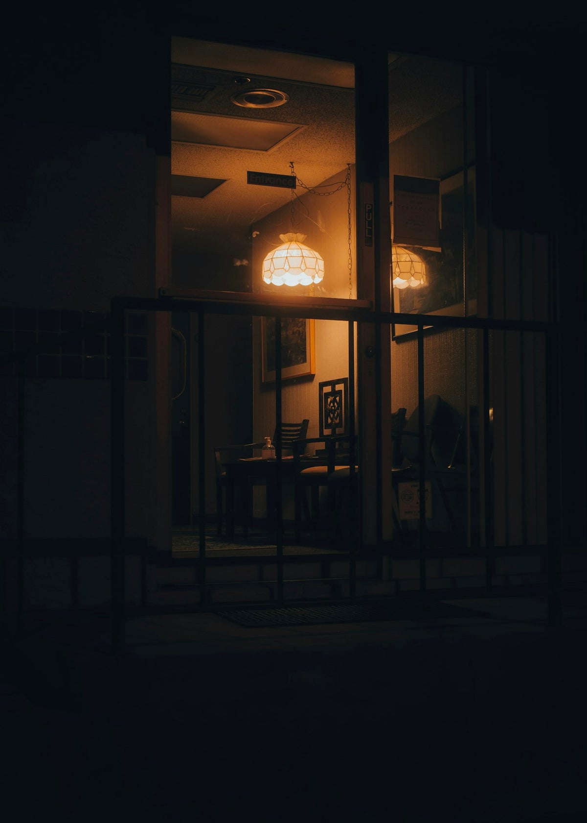 Dimly lit study room at night with warm light, cozy productive atmosphere